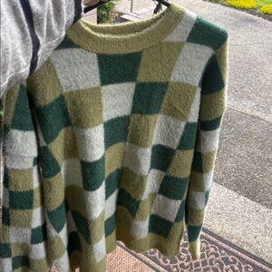 Sweater by Motel,S soft with loose fit. Long sleeves green and cream checkered!